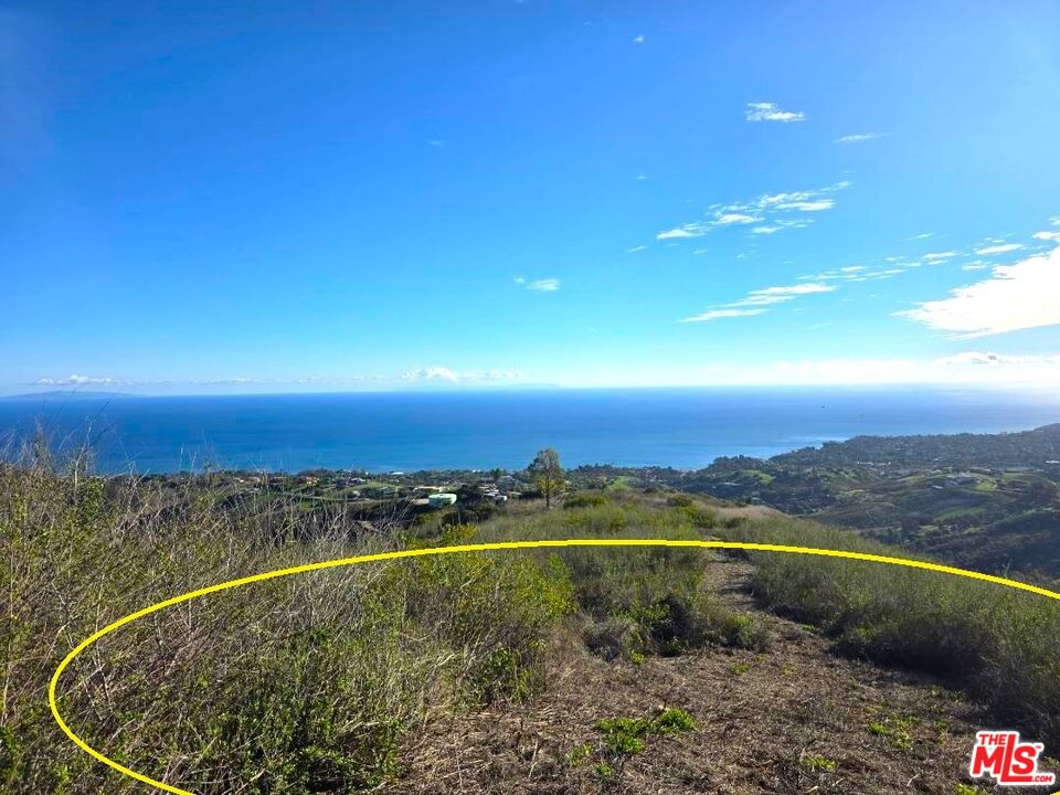5315 Murphy Way Malibu, CA 90265 - Photo 6 of 13 a view of a room with a swimming pool and mountains
