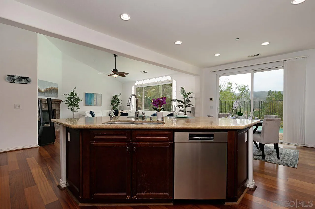 16076 Cayenne Ridge Road San Diego, CA 92127 - Photo 14 of 43 a kitchen with a sink and wooden floor