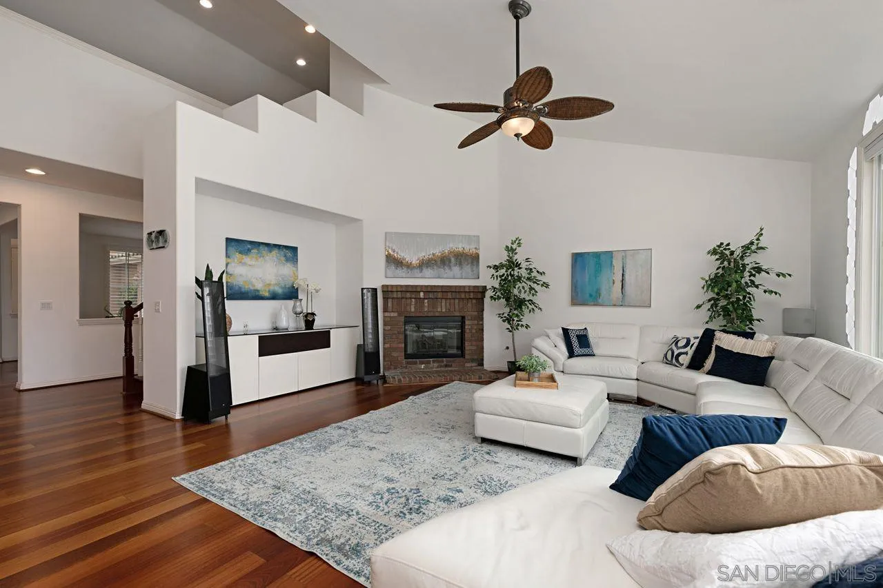 16076 Cayenne Ridge Road San Diego, CA 92127 - Photo 16 of 43 a living room with furniture and a fireplace