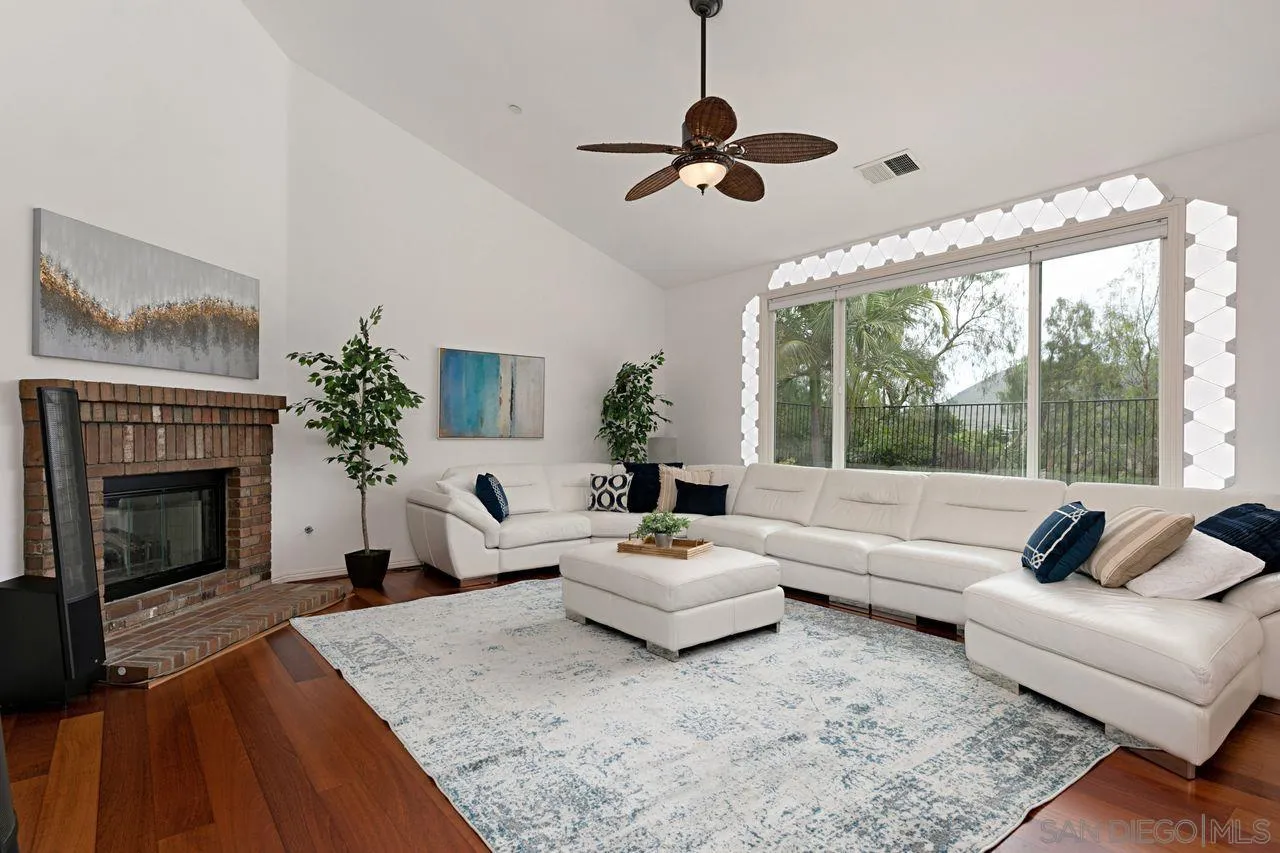 16076 Cayenne Ridge Road San Diego, CA 92127 - Photo 17 of 43 a living room with furniture fireplace and large windows
