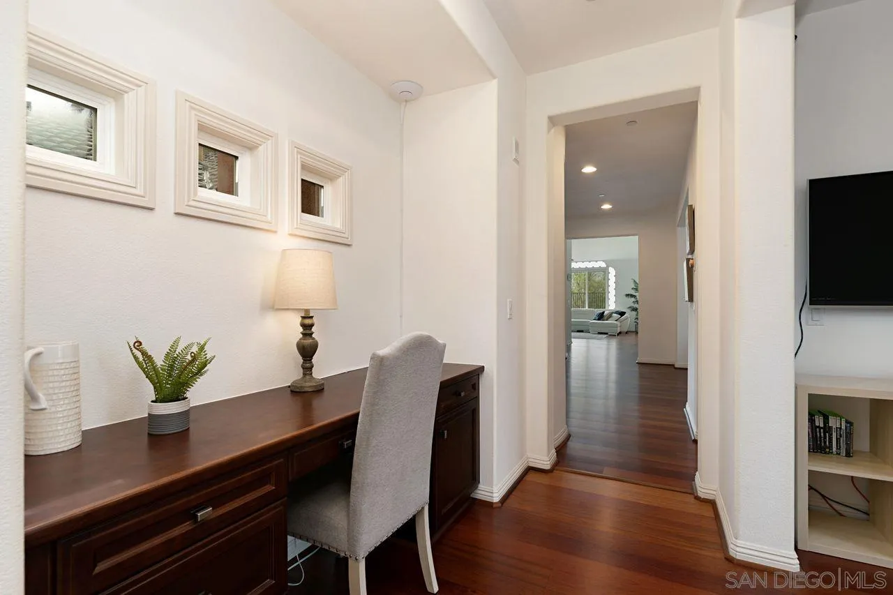 16076 Cayenne Ridge Road San Diego, CA 92127 - Photo 24 of 43 a view of a dining room with furniture and wooden floor