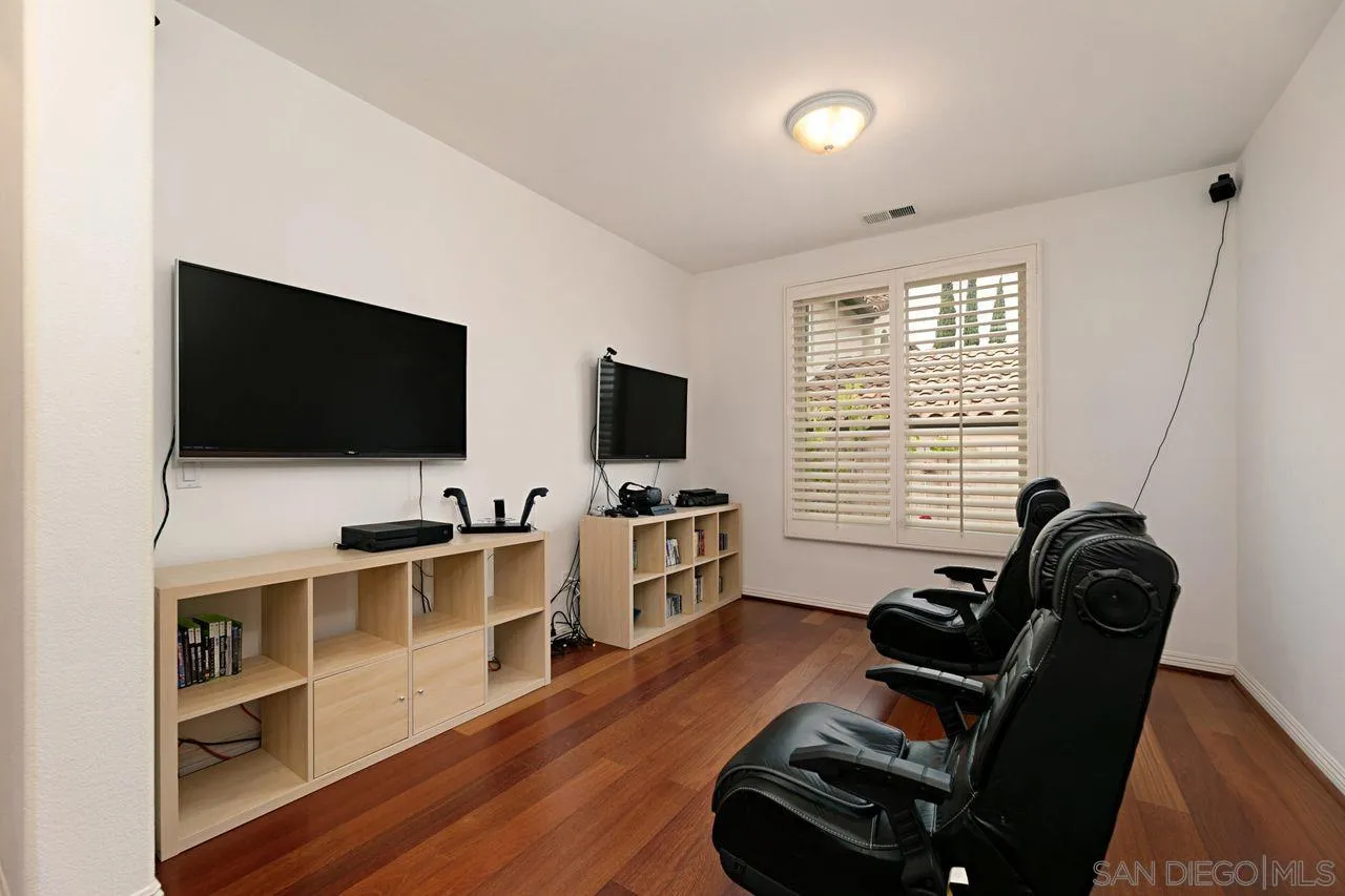 16076 Cayenne Ridge Road San Diego, CA 92127 - Photo 27 of 43 a livingroom with furniture and a flat screen tv