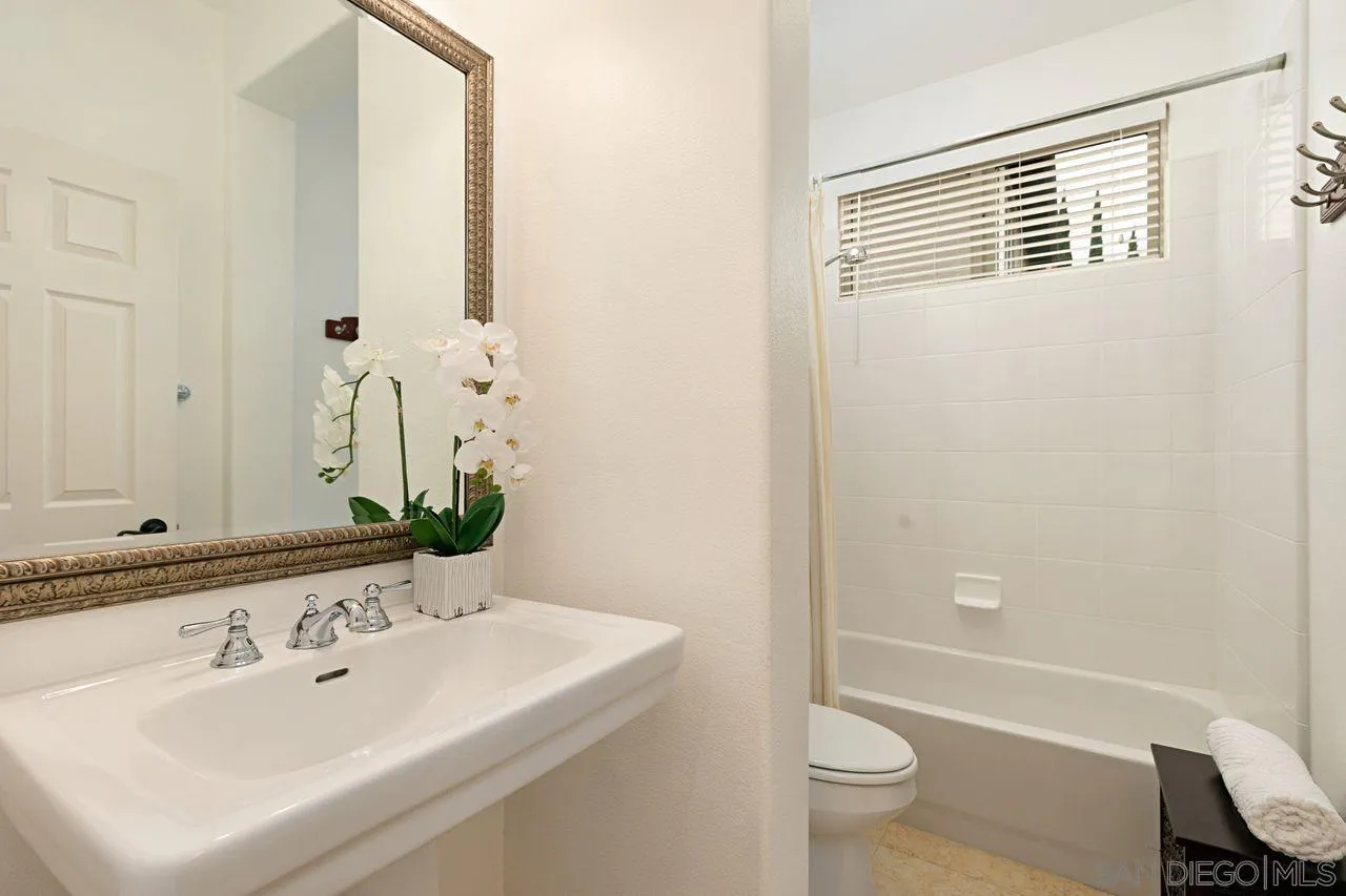 16076 Cayenne Ridge Road San Diego, CA 92127 - Photo 28 of 43 a bathroom with a sink a toilet and shower