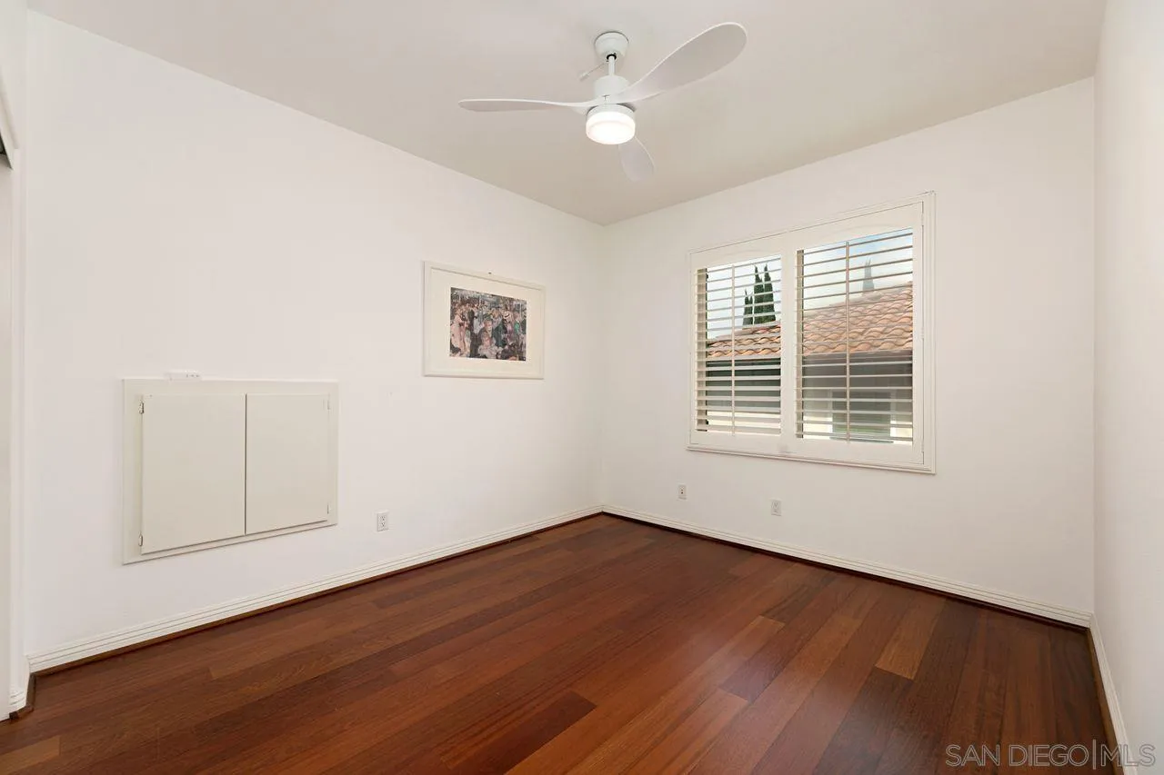 16076 Cayenne Ridge Road San Diego, CA 92127 - Photo 32 of 43 wooden floor in an empty room with a window