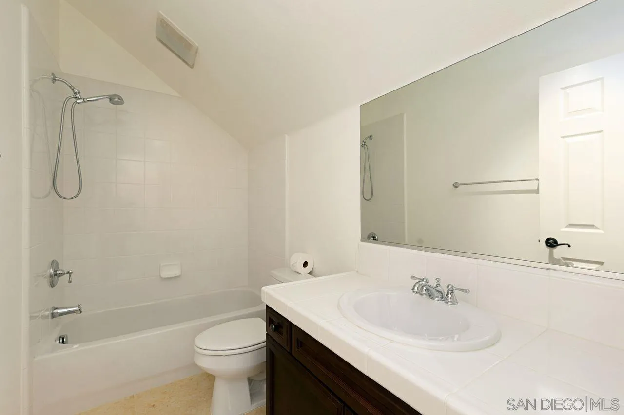16076 Cayenne Ridge Road San Diego, CA 92127 - Photo 33 of 43 a bathroom with a granite countertop sink toilet and shower