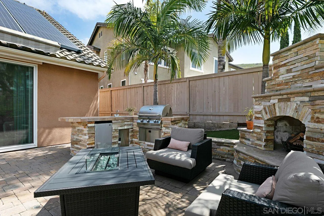16076 Cayenne Ridge Road San Diego, CA 92127 - Photo 38 of 43 a view of a patio with couches table and chairs with potted plants