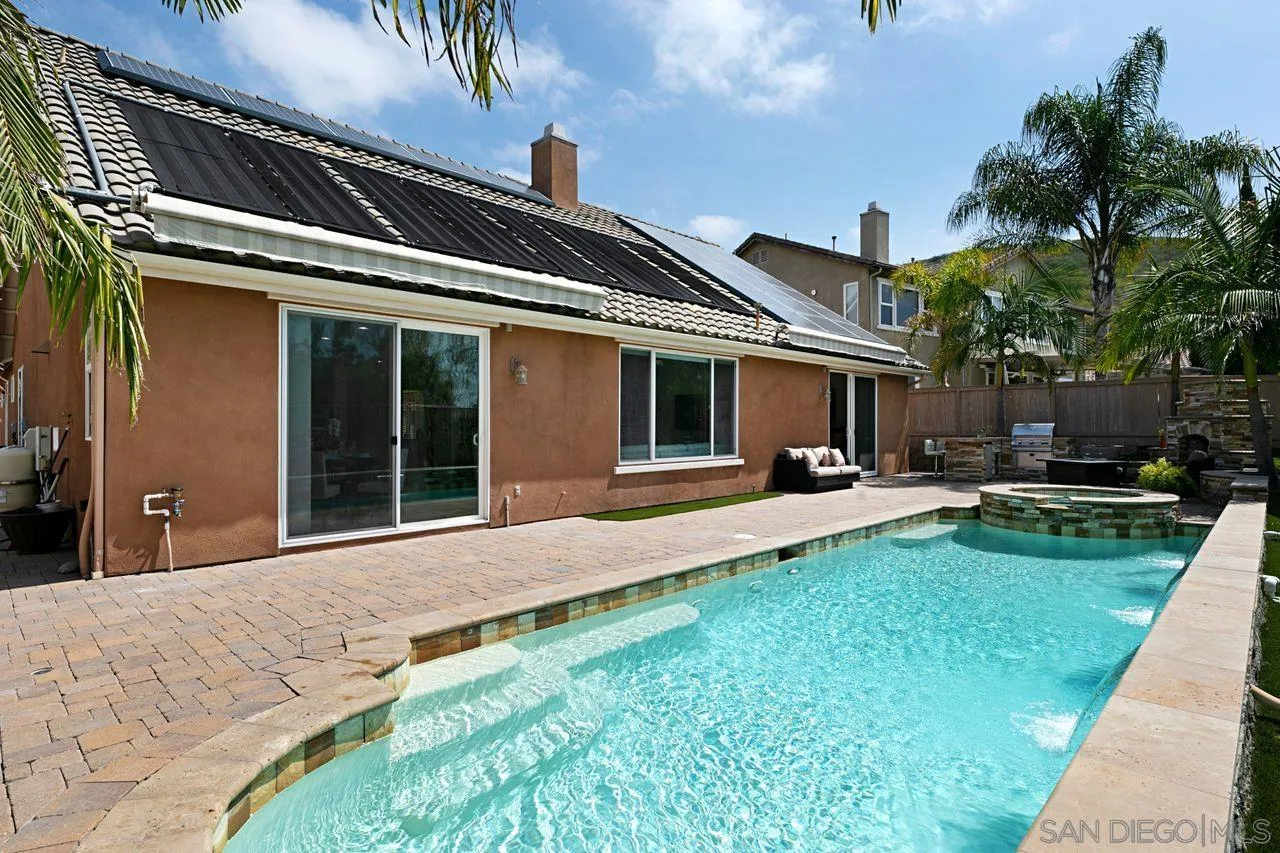 16076 Cayenne Ridge Road San Diego, CA 92127 - Photo 39 of 43 a front view of a house with a yard