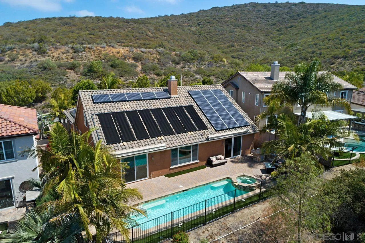 16076 Cayenne Ridge Road San Diego, CA 92127 - Photo 41 of 43 an aerial view of a house with a yard