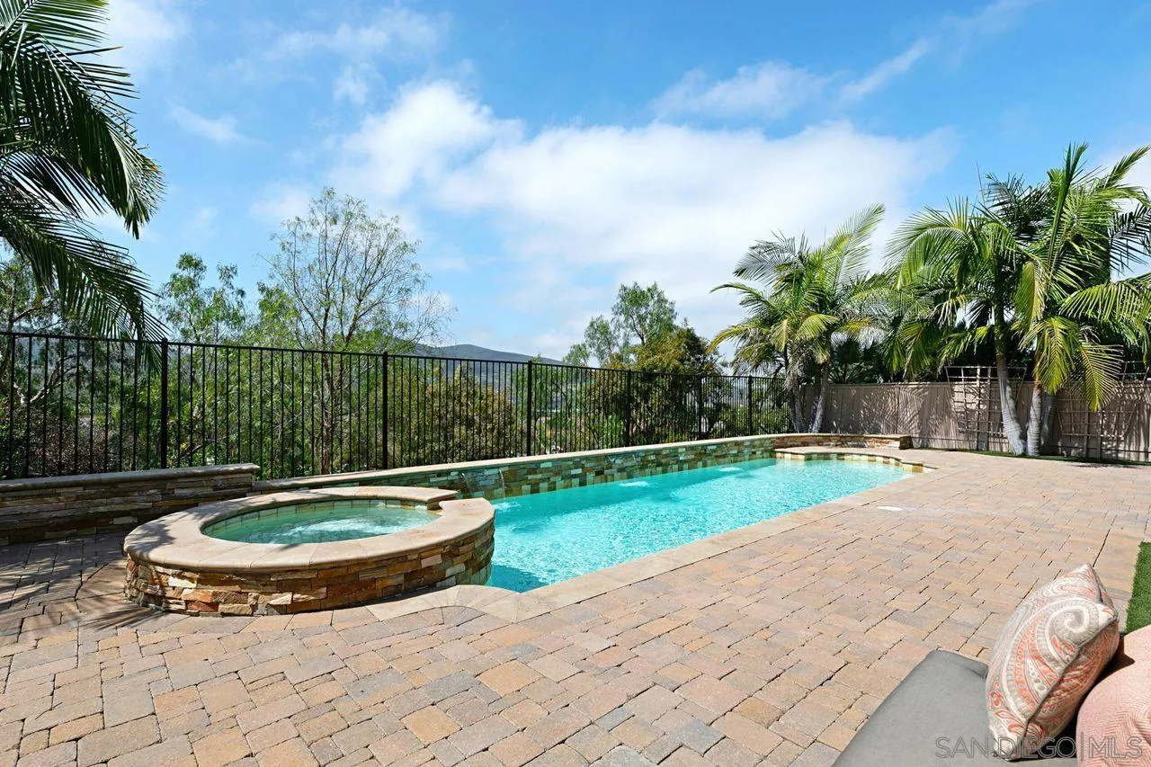 16076 Cayenne Ridge Road San Diego, CA 92127 - Photo 5 of 43 a view of a swimming pool with a yard