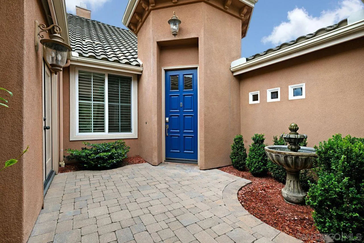 16076 Cayenne Ridge Road San Diego, CA 92127 - Photo 6 of 43 a front view of a house with garden