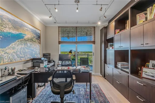 a kitchen with sink refrigerator and cabinets