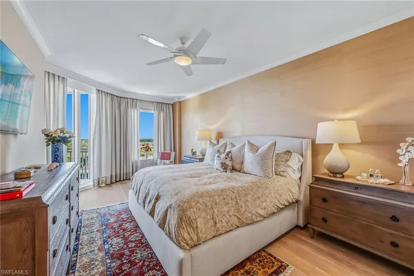 a bedroom with a bed and lamp with window