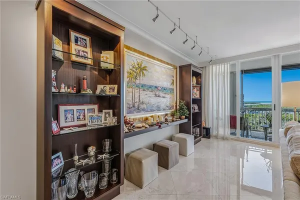 a room with furniture cabinets and a window