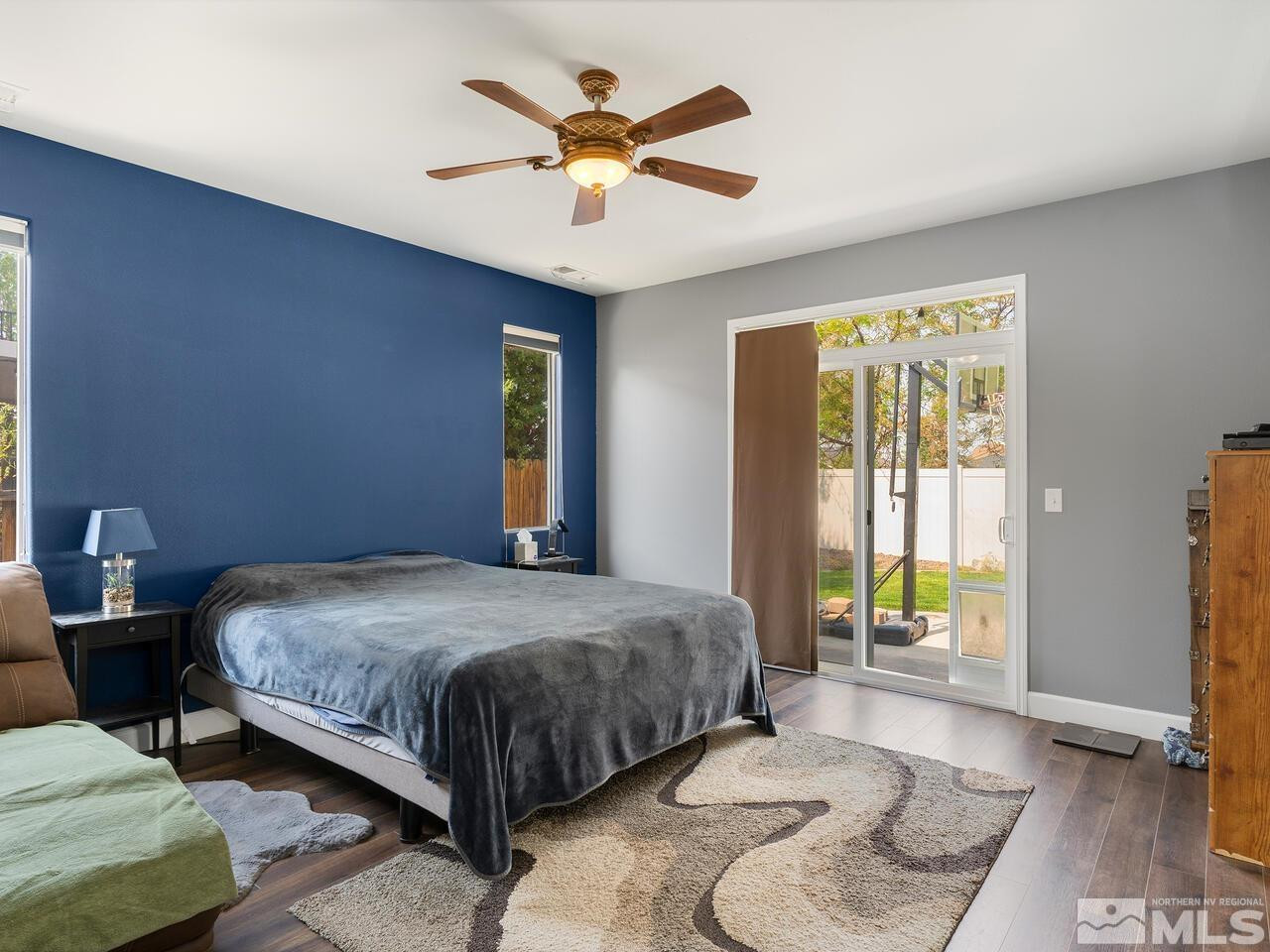 10805 Dancing Aspen Drive Reno, NV 89521 - Photo 16 of 25 a bedroom with a bed and a large window