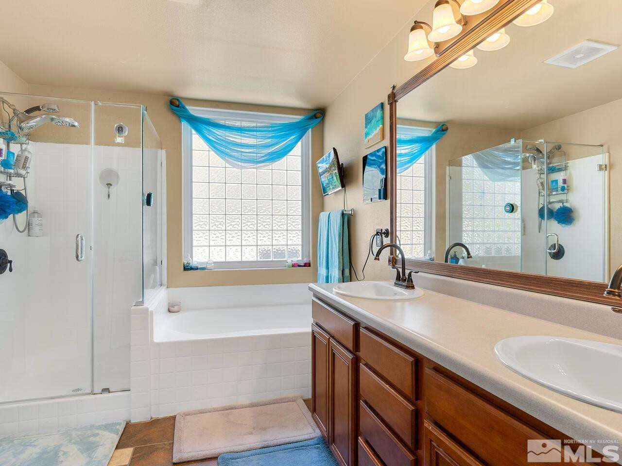 10805 Dancing Aspen Drive Reno, NV 89521 - Photo 17 of 25 a bathroom with a granite countertop sink and a bathtub