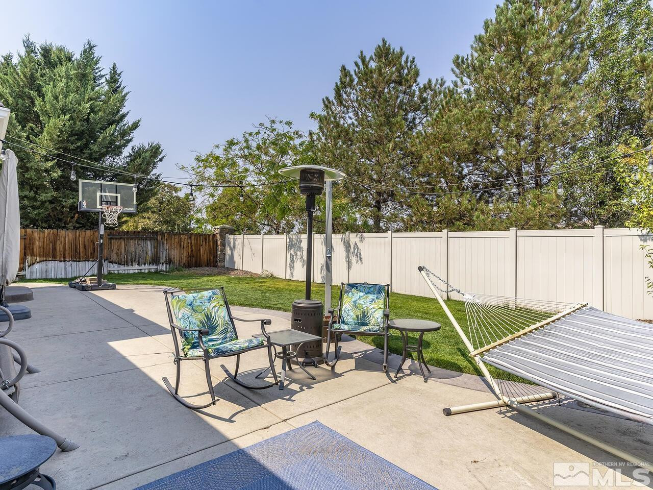 10805 Dancing Aspen Drive Reno, NV 89521 - Photo 23 of 25 a view of a patio with a table and chairs