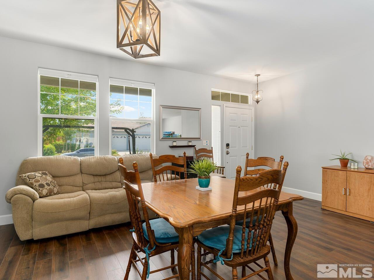 10805 Dancing Aspen Drive Reno, NV 89521 - Photo 7 of 25 a living room with furniture a wooden floor and a window