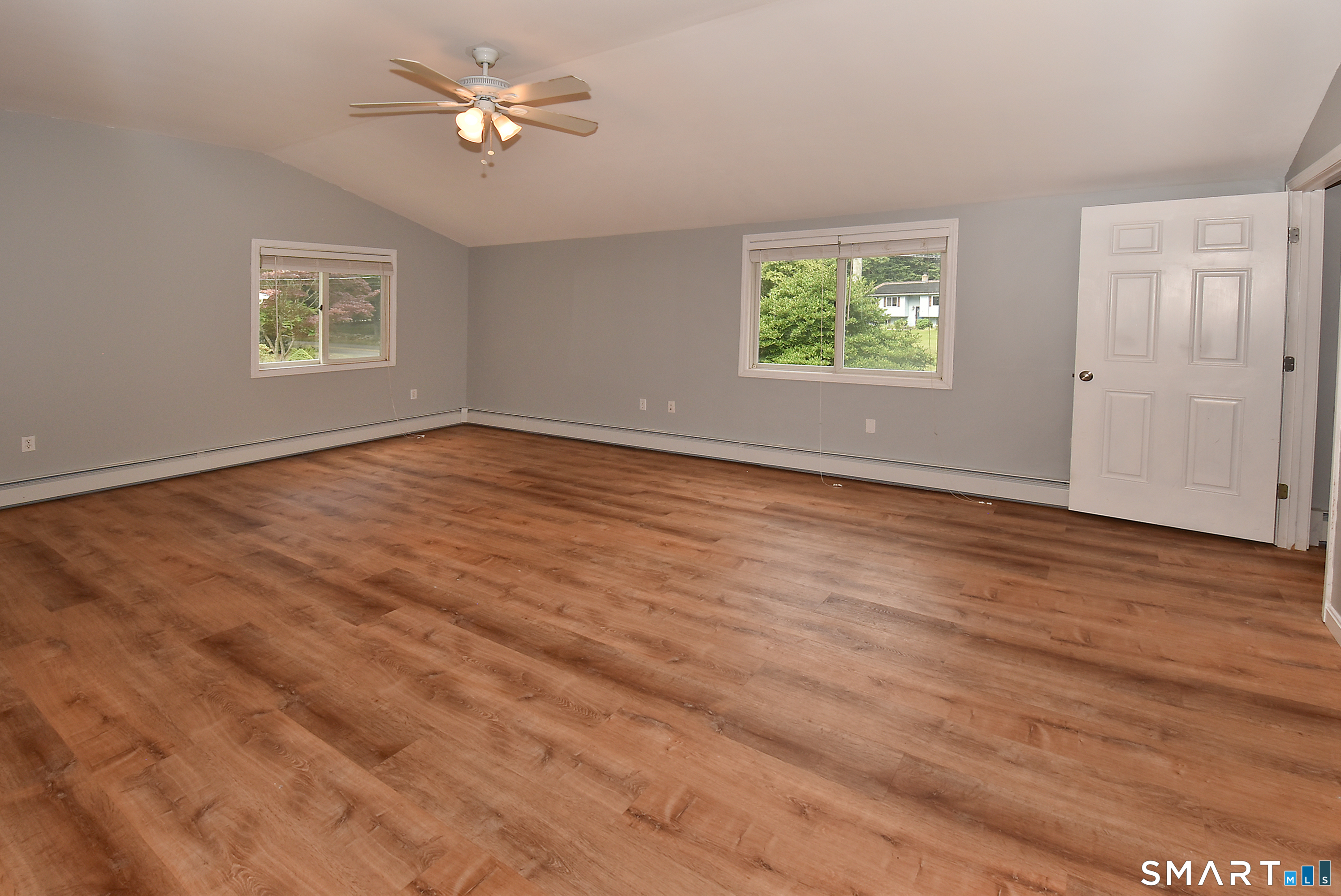 50 Doubleday Road Columbia, CT 06237 - Photo 21 of 29 Large windows flood the interior with an abundance of natural light, creating a bright and airy atmosphere.