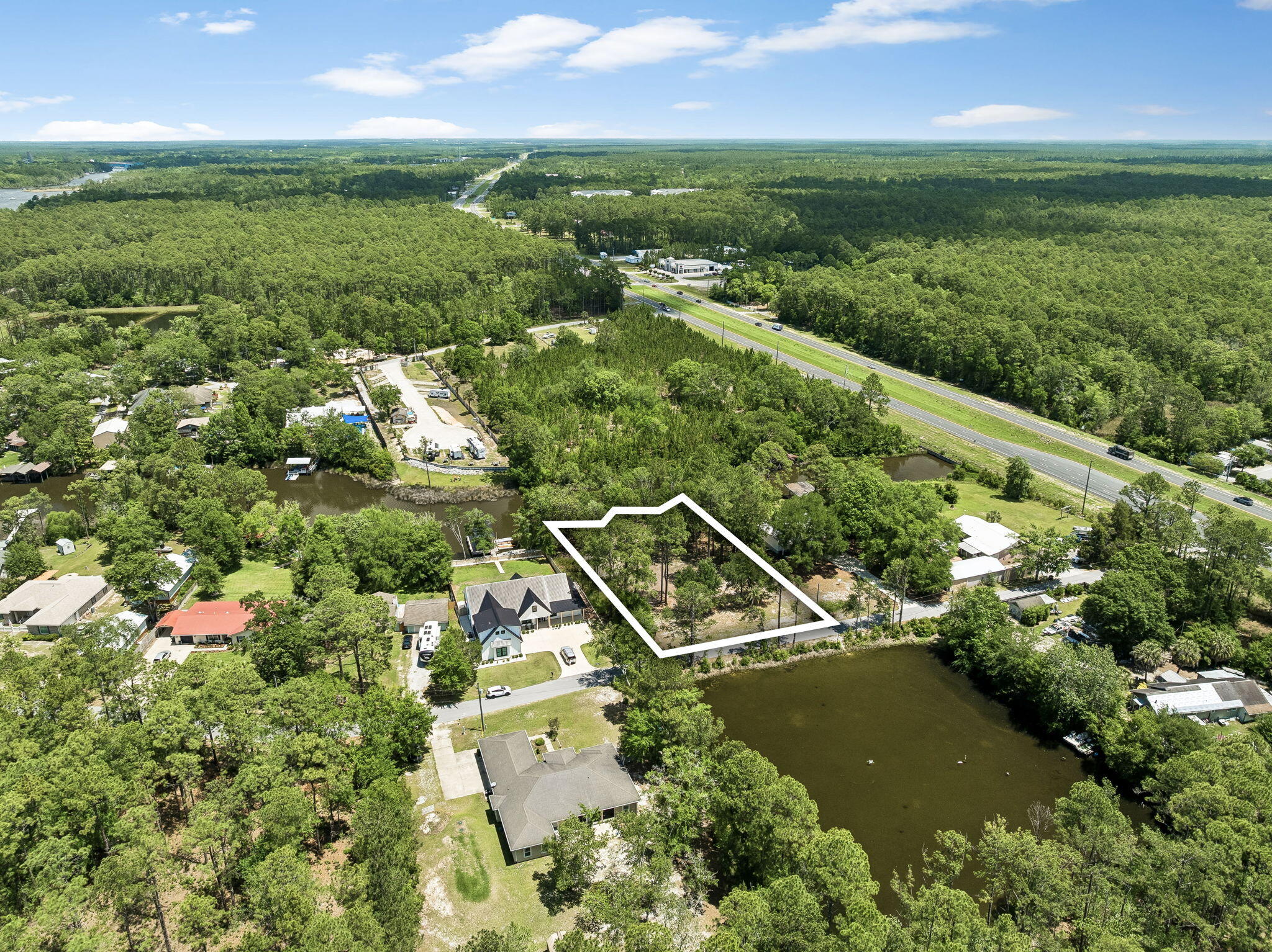 92 Waterside Lane Freeport, FL 32439 - Photo 8 of 28 an aerial view of residential houses with outdoor space and trees