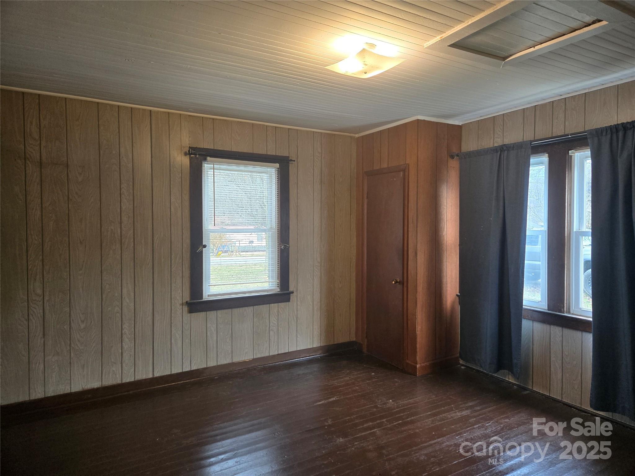 999 Chipper Curve Road Sylva, NC 28779 - Photo 14 of 17 a view of an empty room with wooden floor and a window