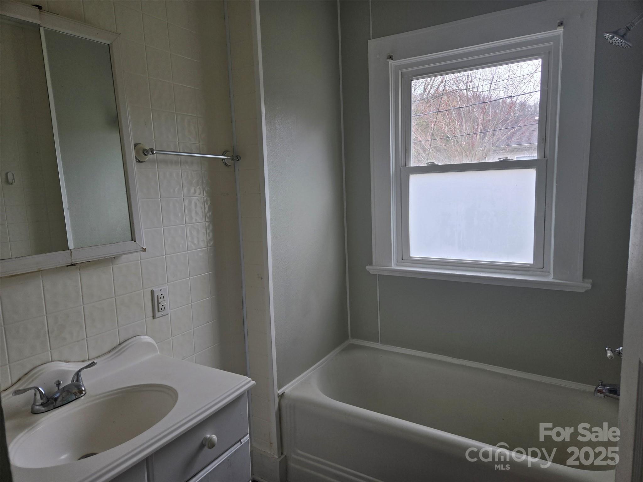 999 Chipper Curve Road Sylva, NC 28779 - Photo 10 of 17 a bathroom with a sink and a bathtub