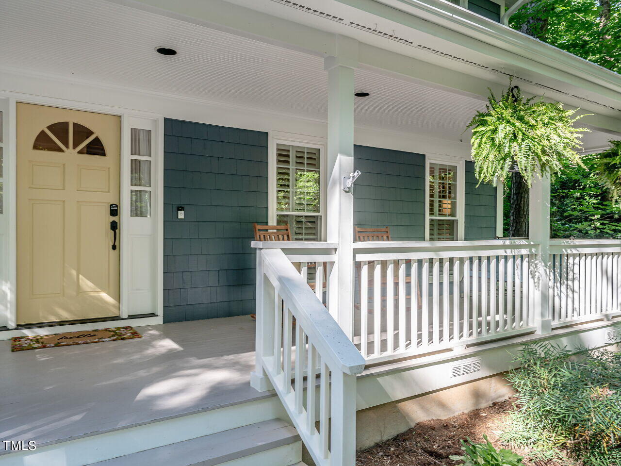 8313 North Creek Run Raleigh, NC 27613 - Photo 4 of 44 a porch with a table in balcony