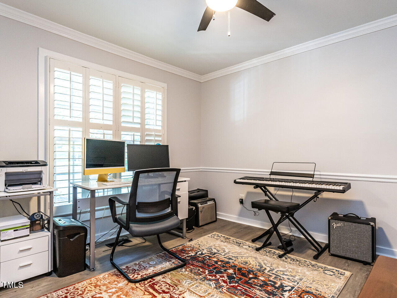 8313 North Creek Run Raleigh, NC 27613 - Photo 7 of 44 a view of a workspace with furniture and a window