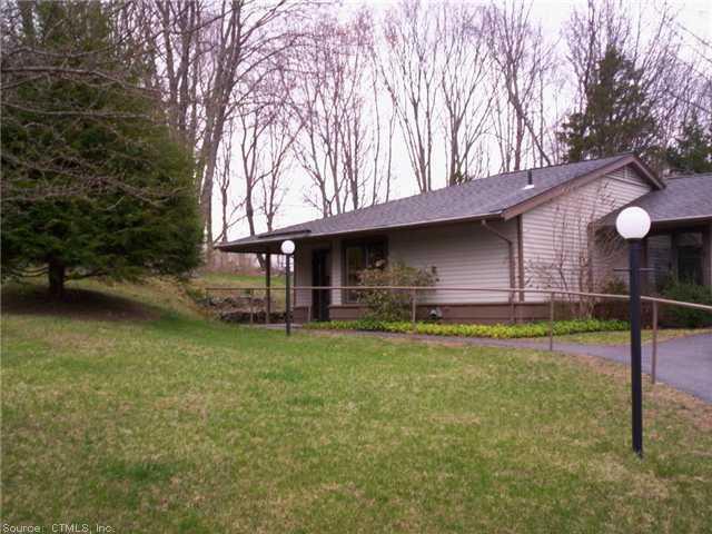 21 Silo Road, Unit 2A Mansfield, CT 06268 - Photo 1 of 1 a backyard of a house with table and chairs