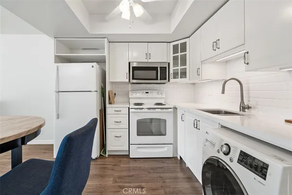 a kitchen with stainless steel appliances a stove a microwave and a refrigerator