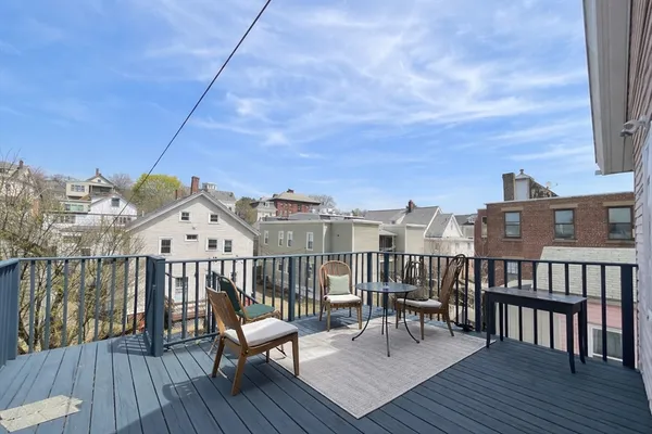 a view of a balcony with wooden floor