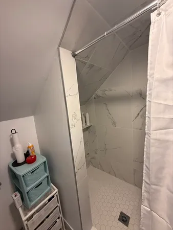 a bathroom with a sink mirror and vanity