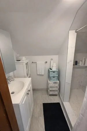 a utility room with cabinets washer and dryer