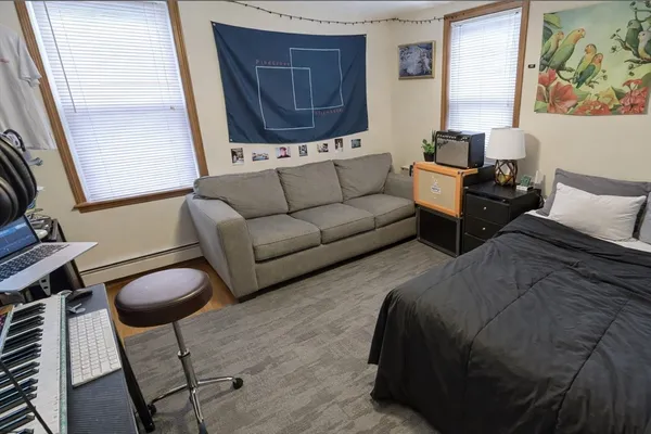 a living room with furniture a couch and a window