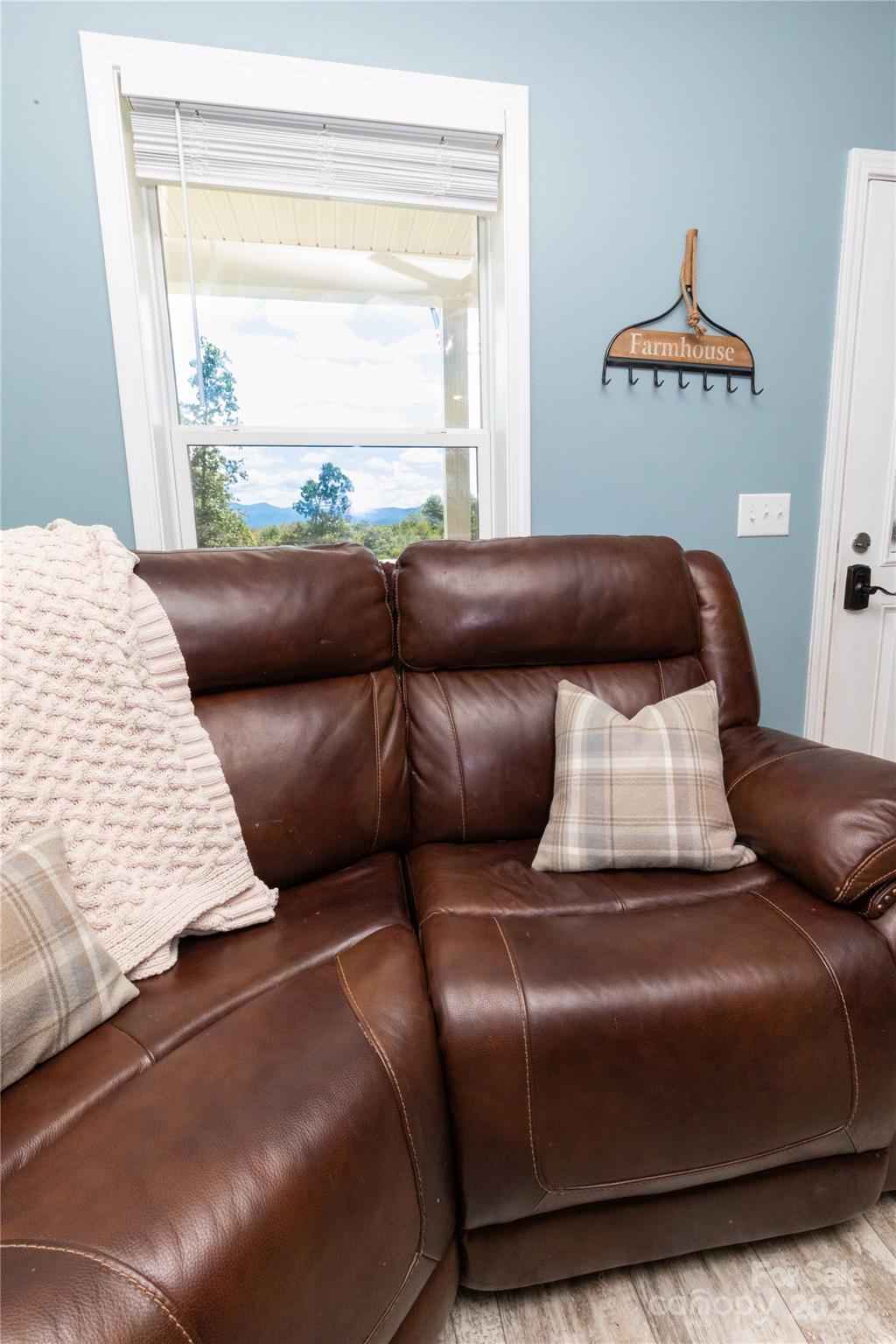 653 Mag Sluder Road Alexander, NC 28701 - Photo 11 of 28 a bedroom with a bed and a couch