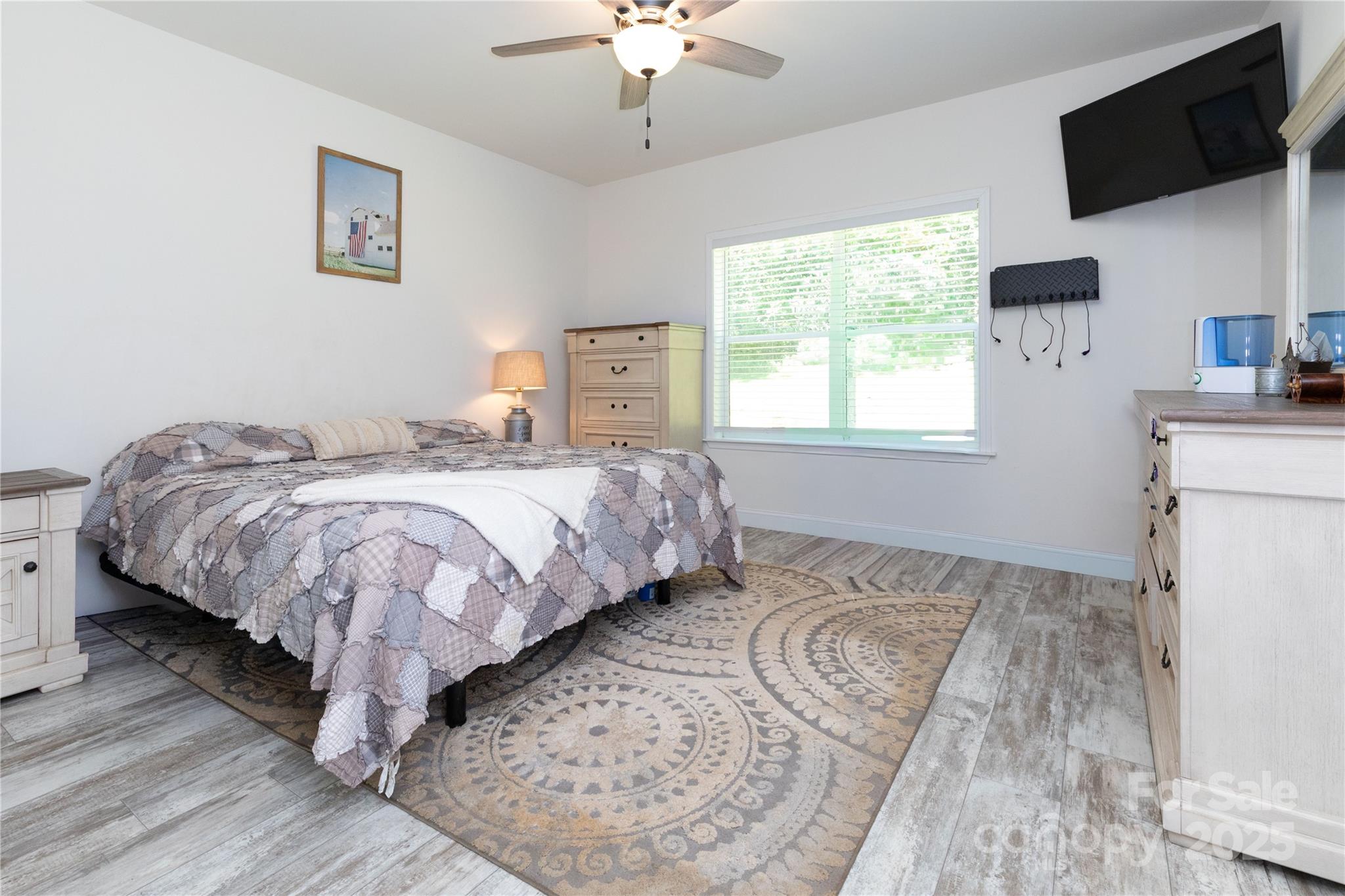 653 Mag Sluder Road Alexander, NC 28701 - Photo 16 of 28 a bedroom with a bed and a flat screen tv