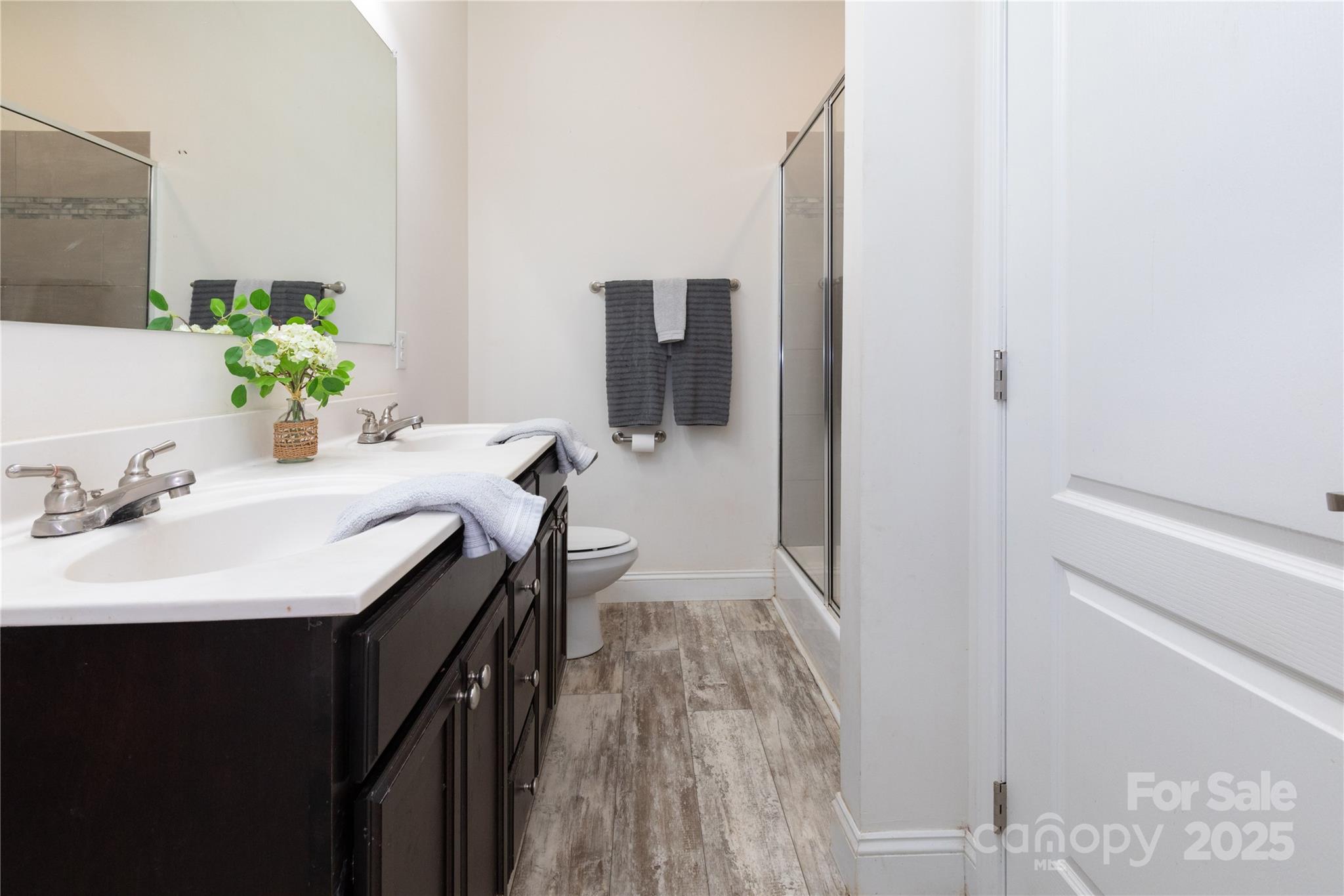 653 Mag Sluder Road Alexander, NC 28701 - Photo 17 of 28 a en suite bathroom with a granite countertop sink and a mirror