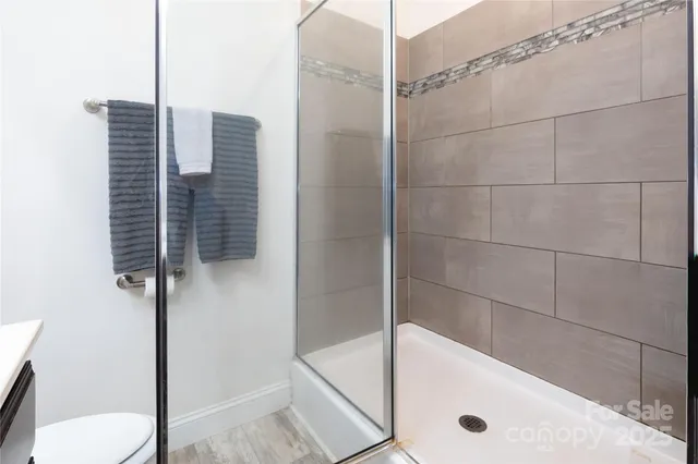 a bathroom with a tub and a shower