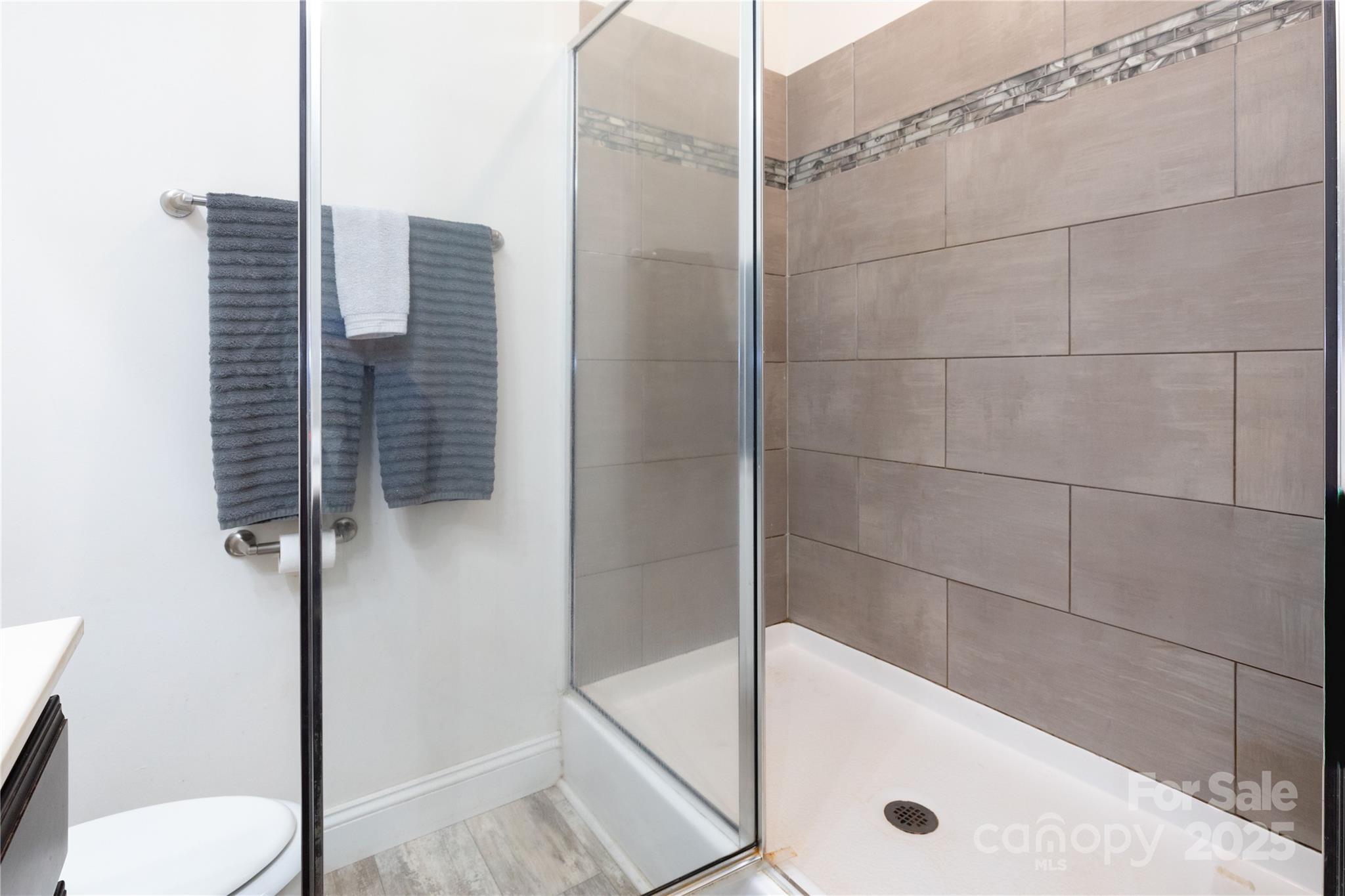 653 Mag Sluder Road Alexander, NC 28701 - Photo 18 of 28 a bathroom with a tub and a shower