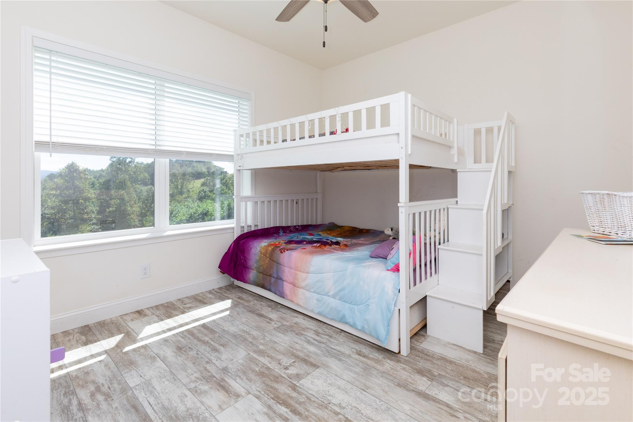 653 Mag Sluder Road Alexander, NC 28701 - Photo 19 of 28 a bedroom with a bed and a window