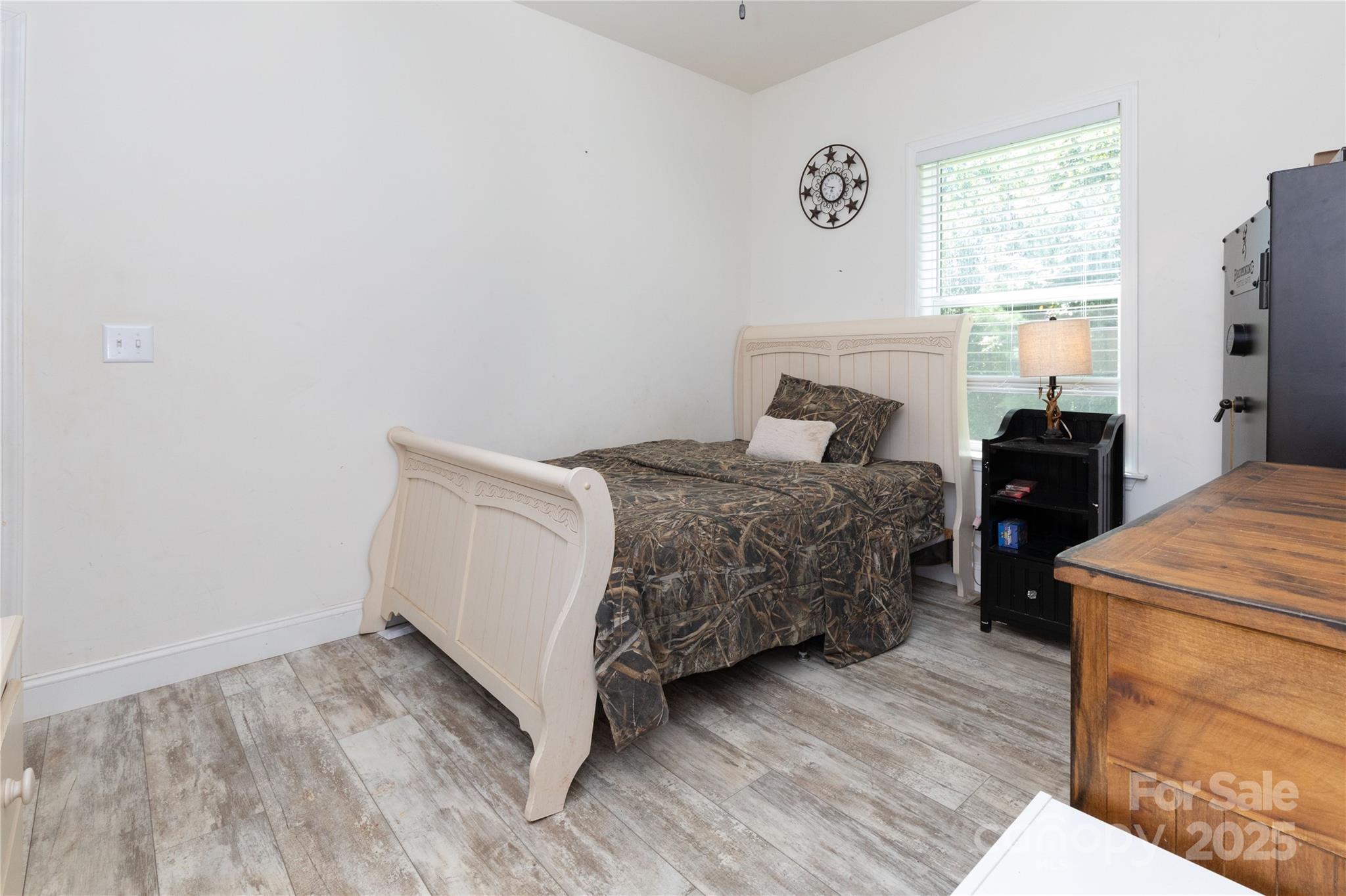 653 Mag Sluder Road Alexander, NC 28701 - Photo 20 of 28 a bedroom with a bed and a window