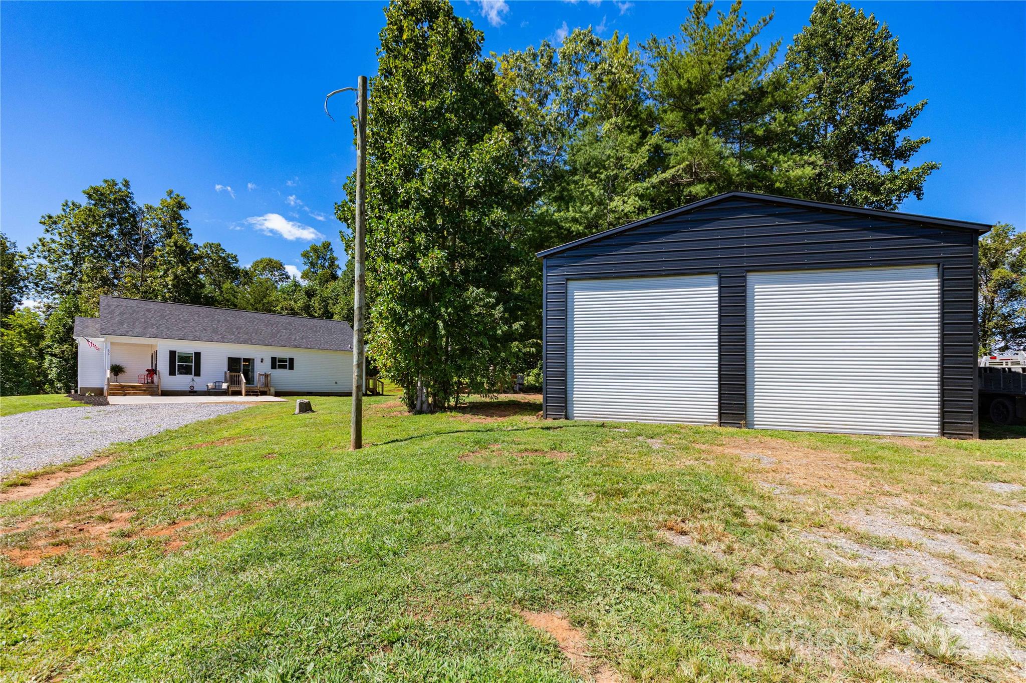 653 Mag Sluder Road Alexander, NC 28701 - Photo 9 of 28 a house that has a tree in front of it