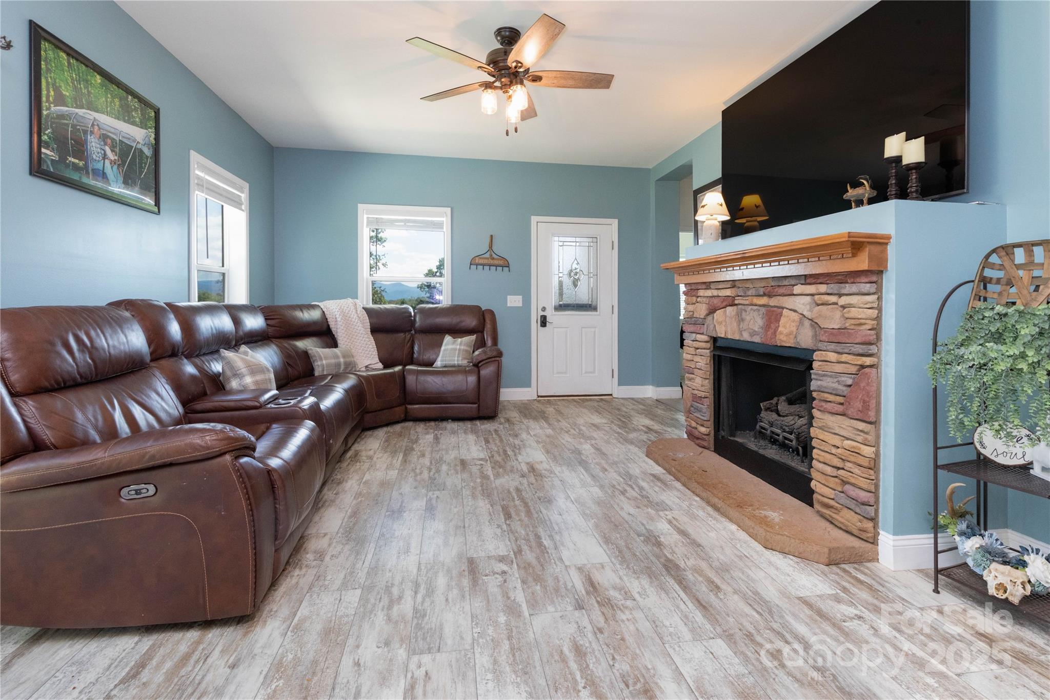 653 Mag Sluder Road Alexander, NC 28701 - Photo 10 of 28 a living room with furniture and a fireplace