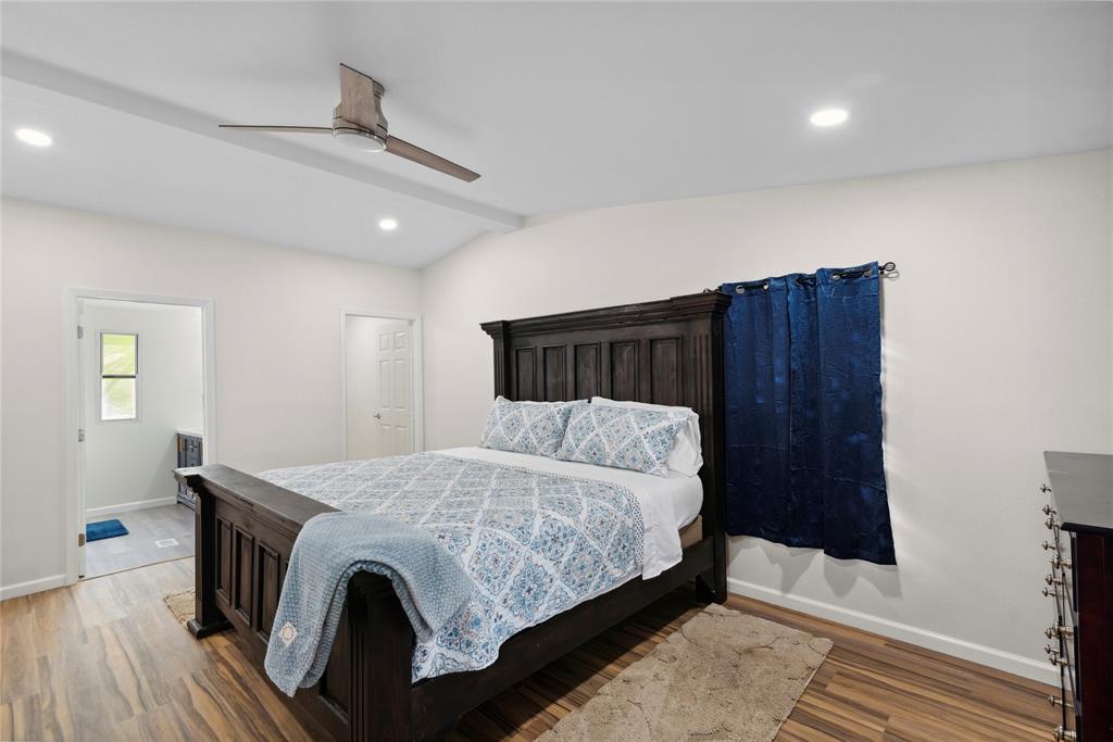 141 Mallard Road Ringgold, LA 71068 - Photo 21 of 33 Vaulted ceiling featuring a contemporary ceiling fan, recessed lighting, wood-finish flooring, and crisp white walls