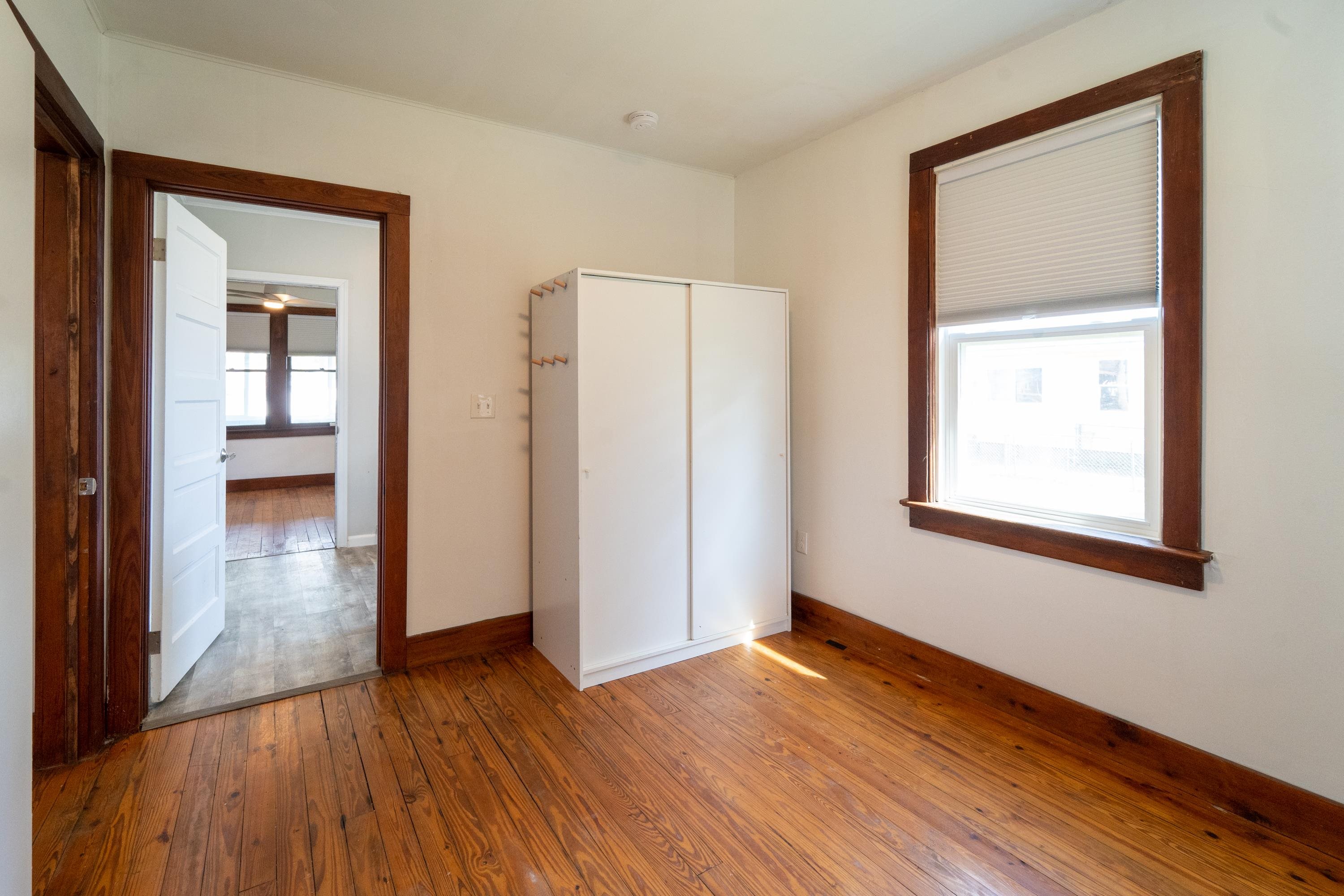 23 Hope Street St. Augustine, FL 32084 - Photo 16 of 22 an empty room with wooden floor and a window