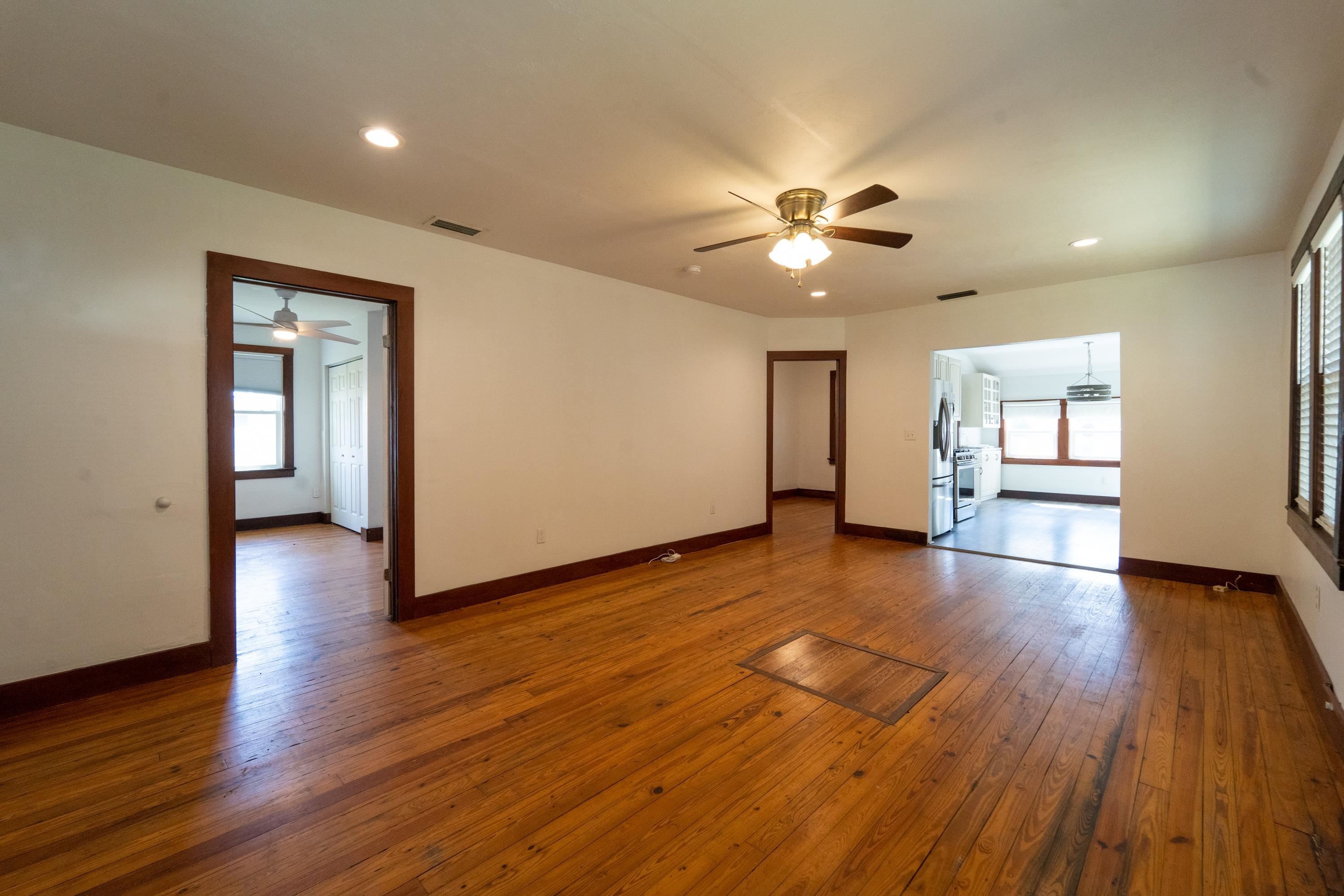 23 Hope Street St. Augustine, FL 32084 - Photo 8 of 22 a view of an empty room with a window and wooden floor