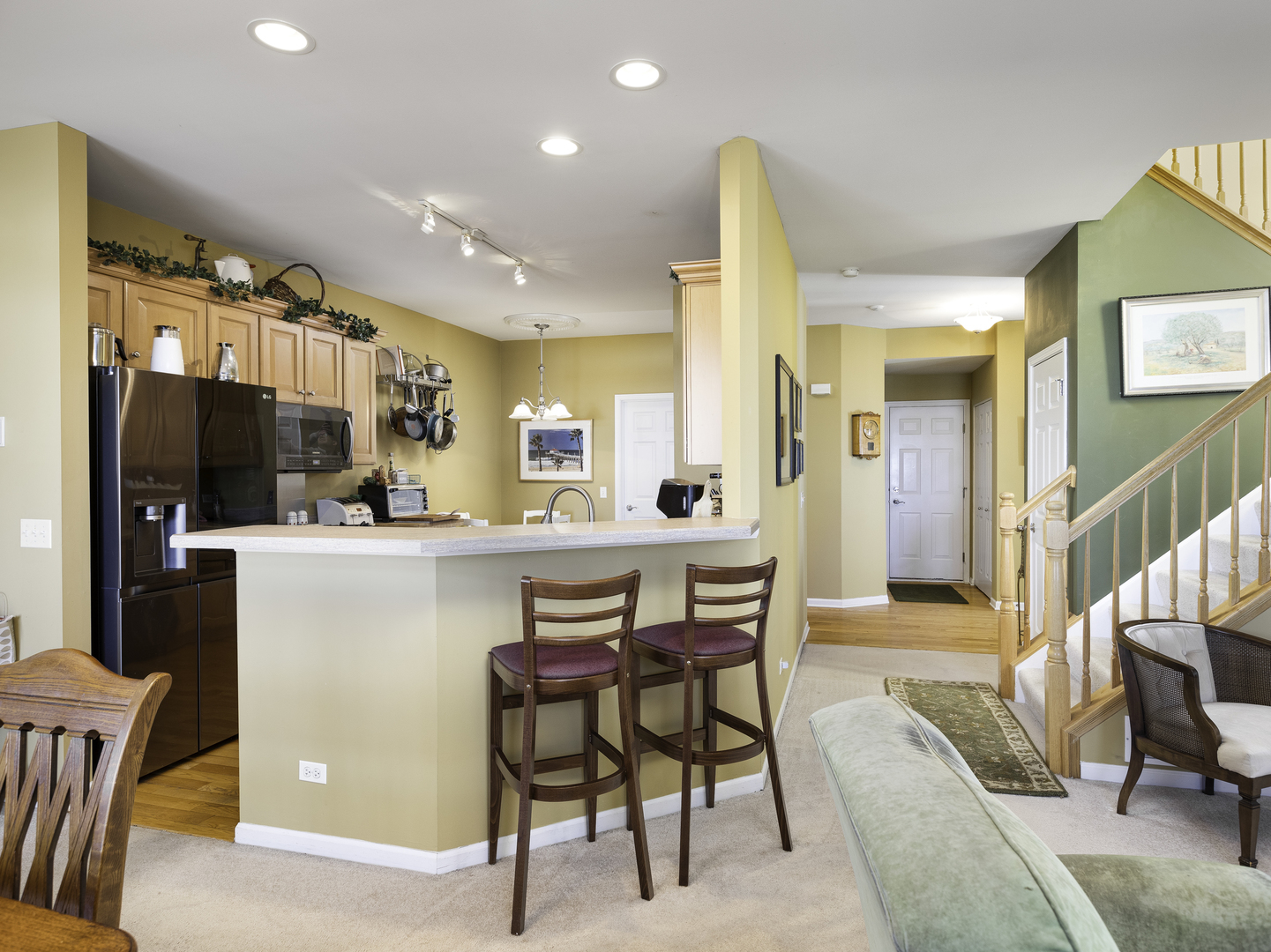 267 Ridge Road North Aurora, IL 60542 - Photo 12 of 27 a dining room with furniture and a kitchen view