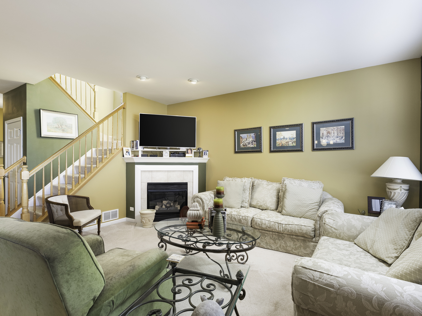 267 Ridge Road North Aurora, IL 60542 - Photo 7 of 27 a living room with furniture a fireplace and a flat screen tv