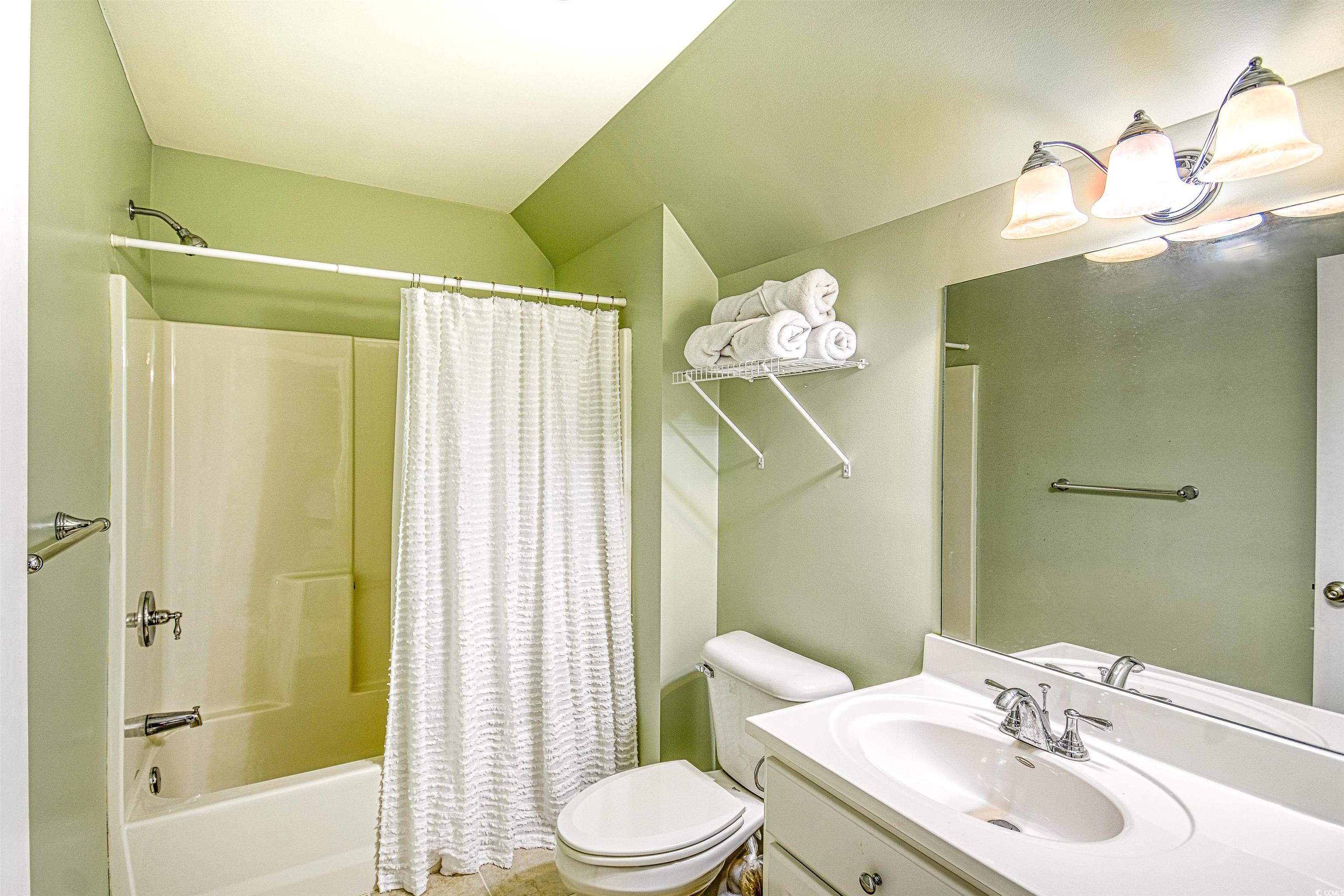 4514 Wagon Run Murrells Inlet, SC 29576 - Photo 16 of 40 Bathroom featuring toilet, lofted ceiling, shower