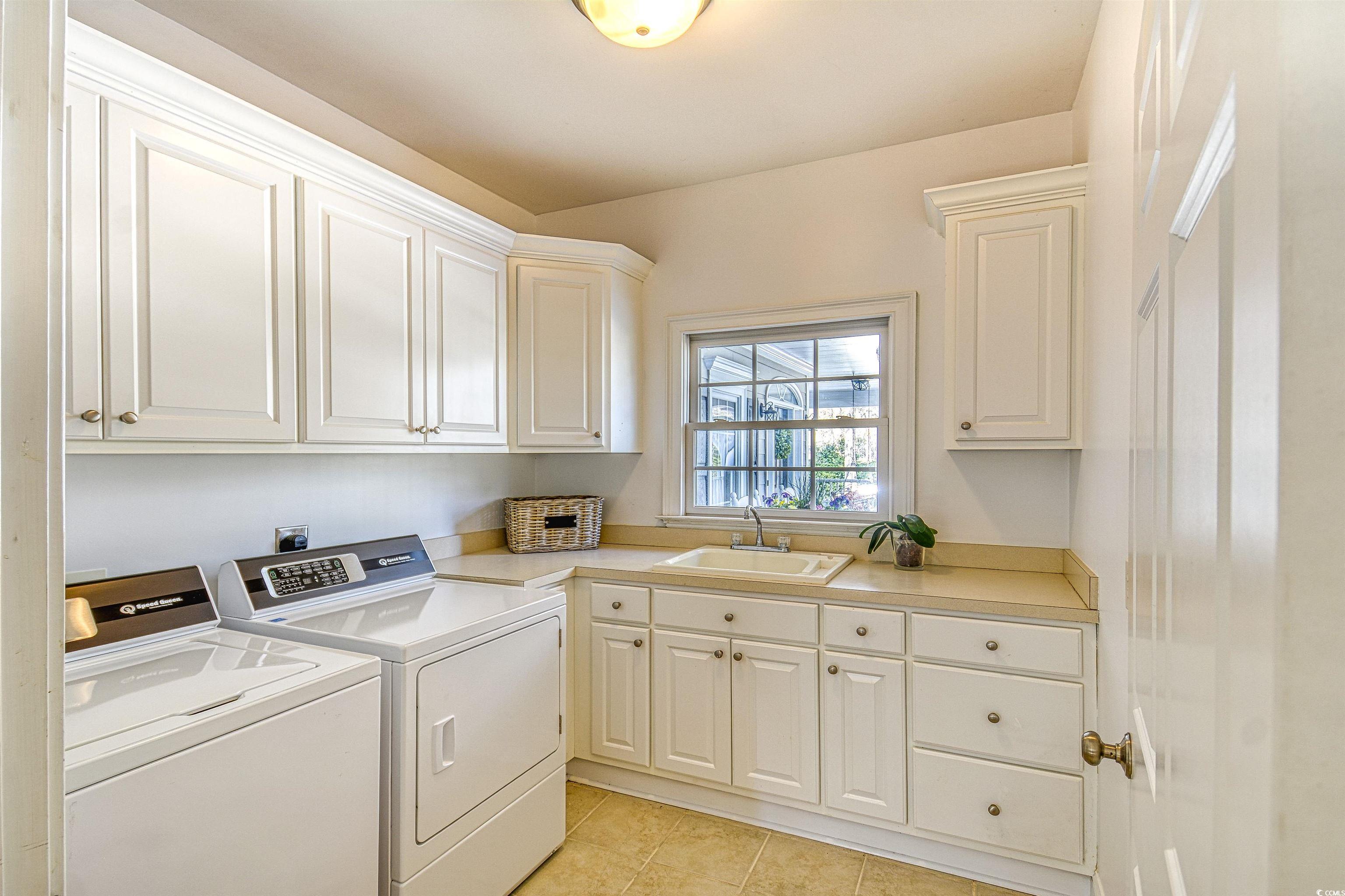 4514 Wagon Run Murrells Inlet, SC 29576 - Photo 25 of 40 Laundry area featuring cabinet space, light tile p
