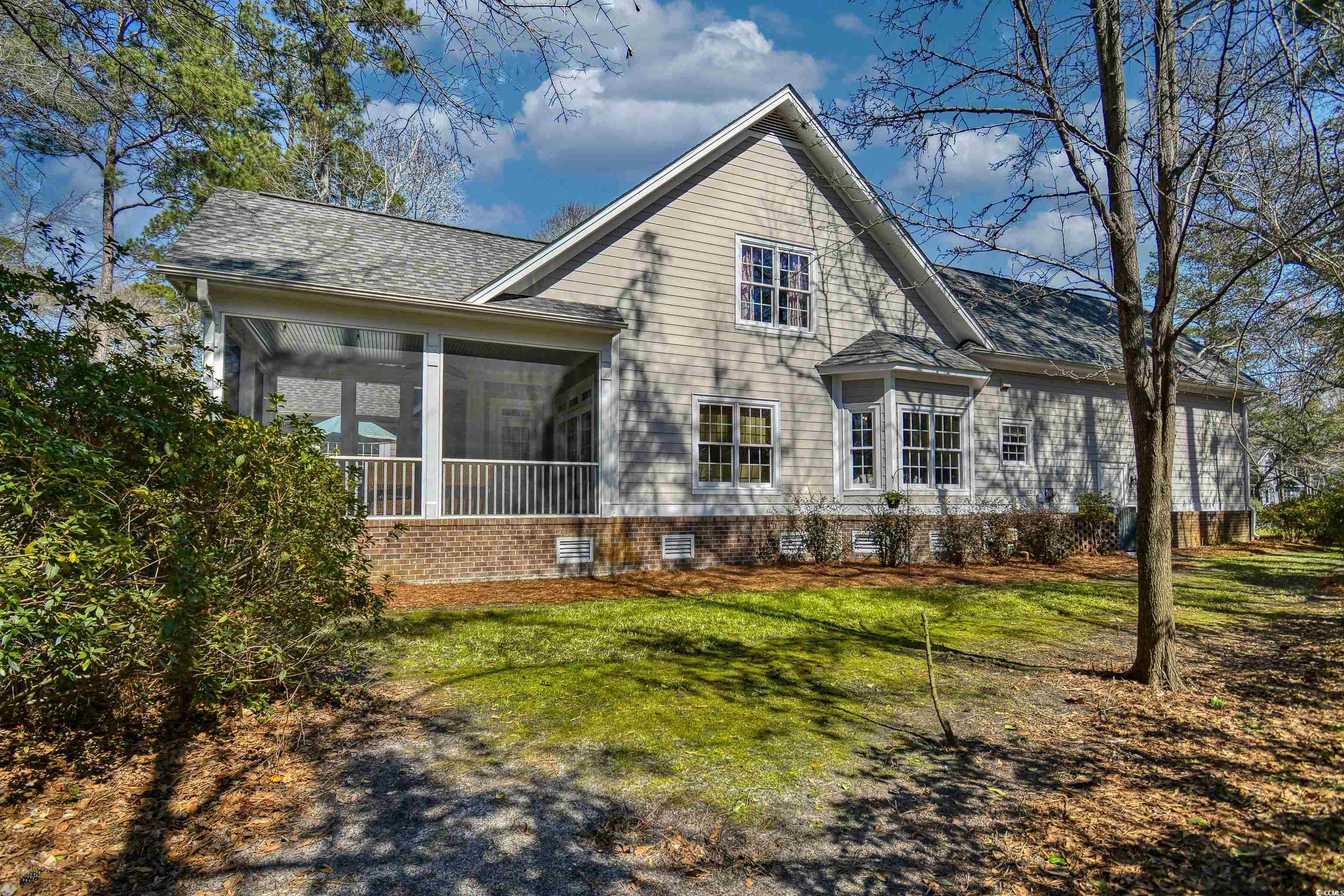 4514 Wagon Run Murrells Inlet, SC 29576 - Photo 35 of 40 Side view of property featuring a shingled roof, a